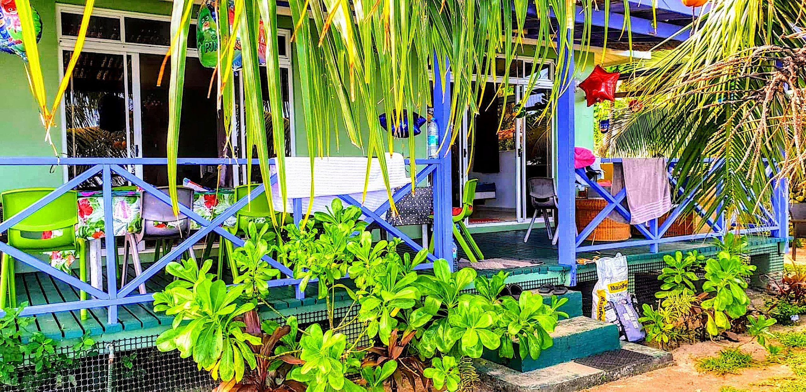 Beautiful terrace overlooking a tropical garden and turquoise lagoon