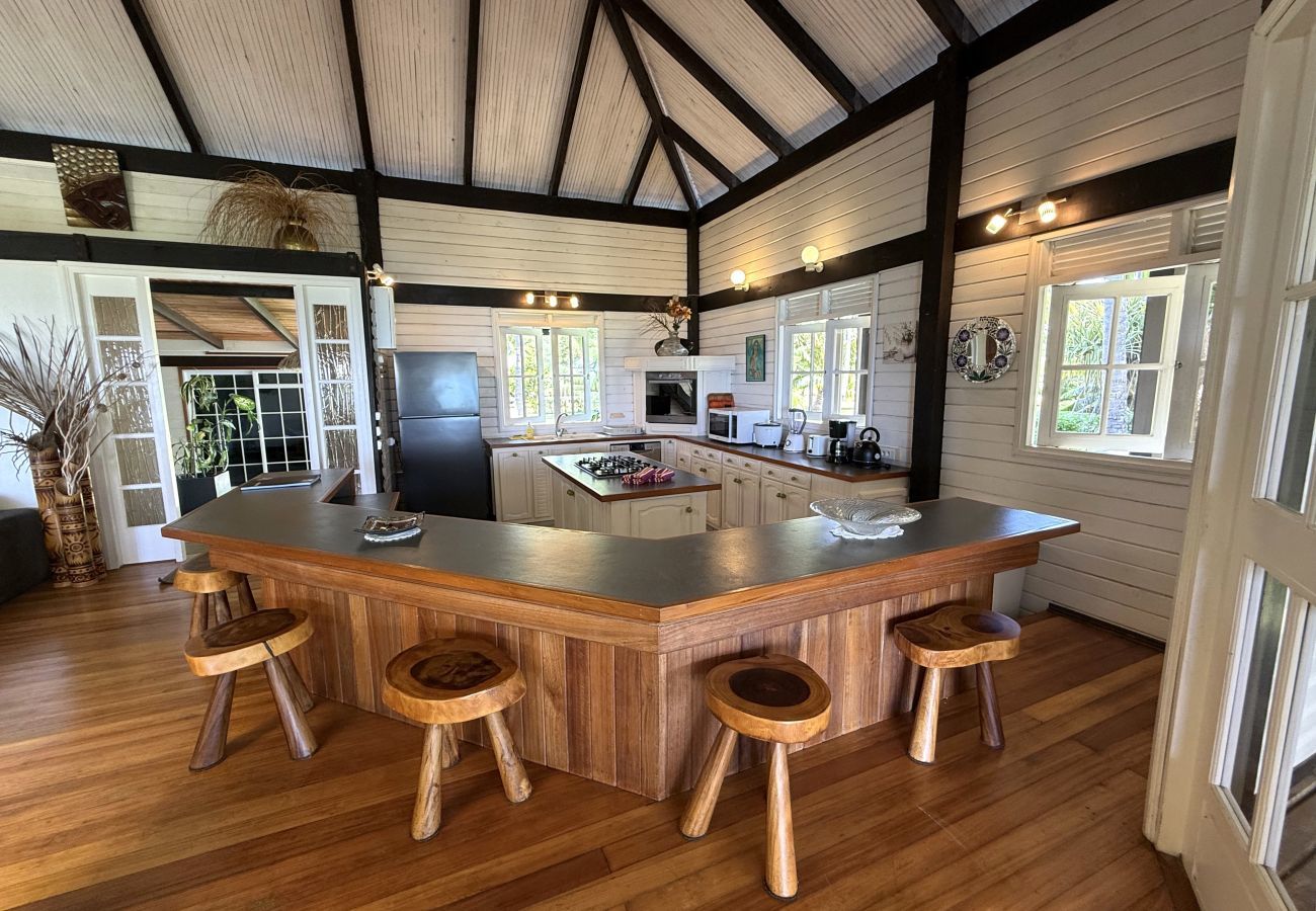 Bright and spacious kitchen with direct access to the terrace and outdoor dining area
